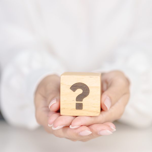 Wood block of Questions Mark sign. FAQ, frequency asked questions, Answer, Q and A, Information, Communication, problem and interrogation Concepts